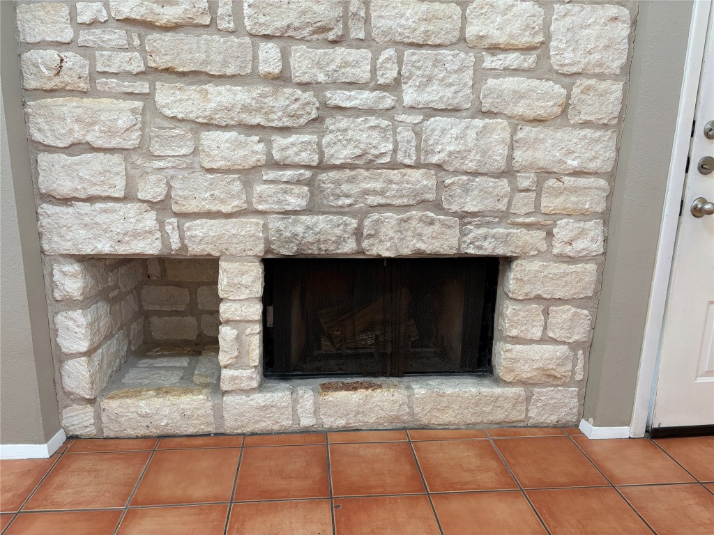 9226 Jollyville Road, Unit 144 Austin, TX 78759 - Photo 3 of 40 Detailed view of a fireplace and baseboards