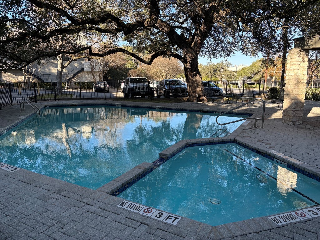 9226 Jollyville Road, Unit 144 Austin, TX 78759 - Photo 35 of 40 View of swimming pool featuring a patio area and a pool with connected hot tub