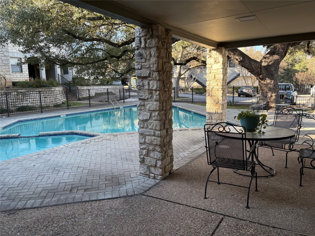 9226 Jollyville Road, Unit 144 Austin, TX 78759 - Photo 36 of 40 View of pool featuring a patio area and a pool with connected hot tub