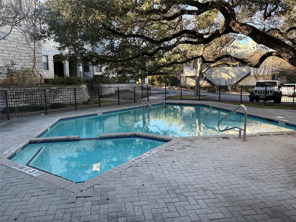 9226 Jollyville Road, Unit 144 Austin, TX 78759 - Photo 37 of 40 View of swimming pool featuring a patio and a pool with connected hot tub