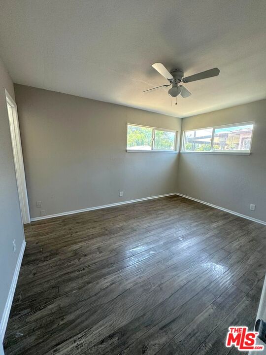 44720 Rodin Avenue Lancaster, CA 93535 - Photo 12 of 18 a view of empty room with wooden floor