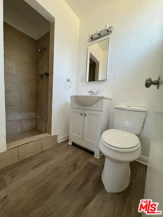 44720 Rodin Avenue Lancaster, CA 93535 - Photo 14 of 18 a bathroom with a toilet sink and mirror