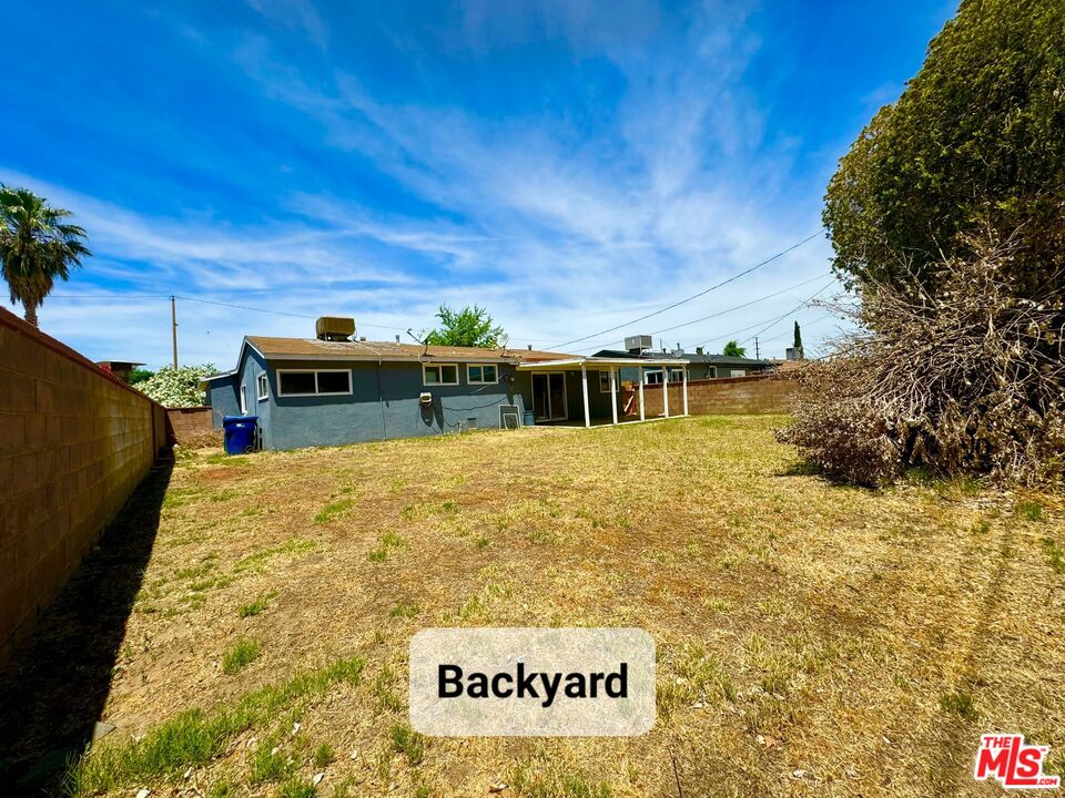 44720 Rodin Avenue Lancaster, CA 93535 - Photo 17 of 18 a view of a house with a yard