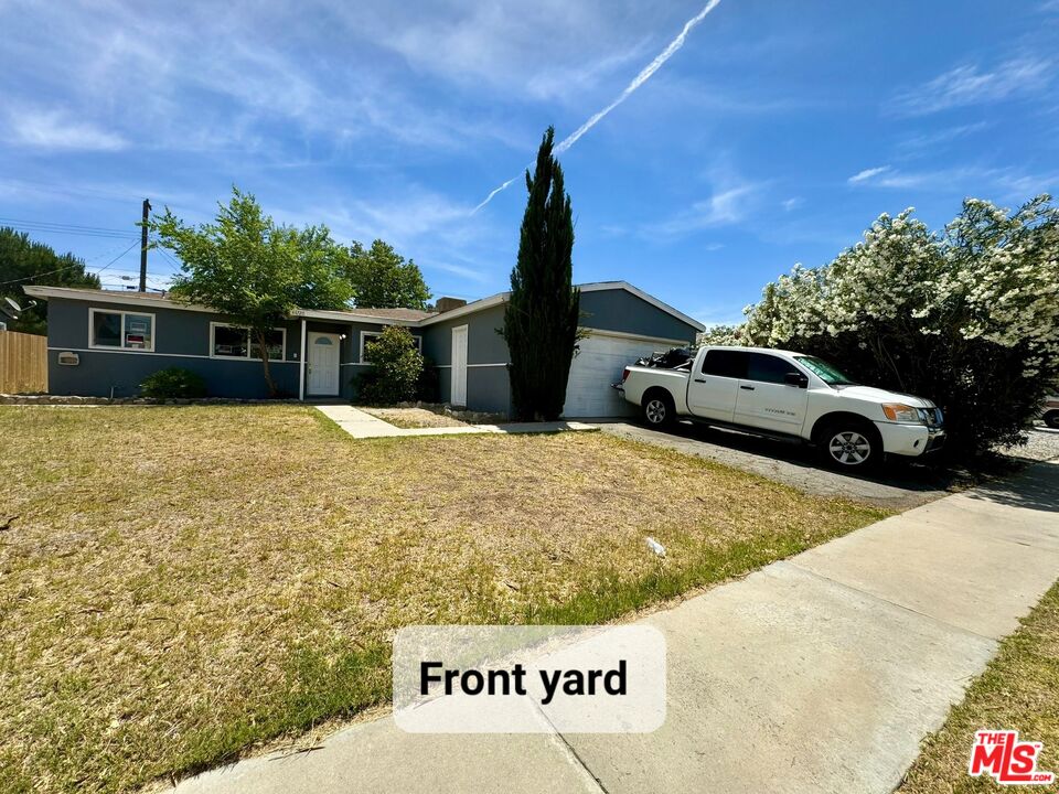44720 Rodin Avenue Lancaster, CA 93535 - Photo 2 of 18 a front view of a house with a yard