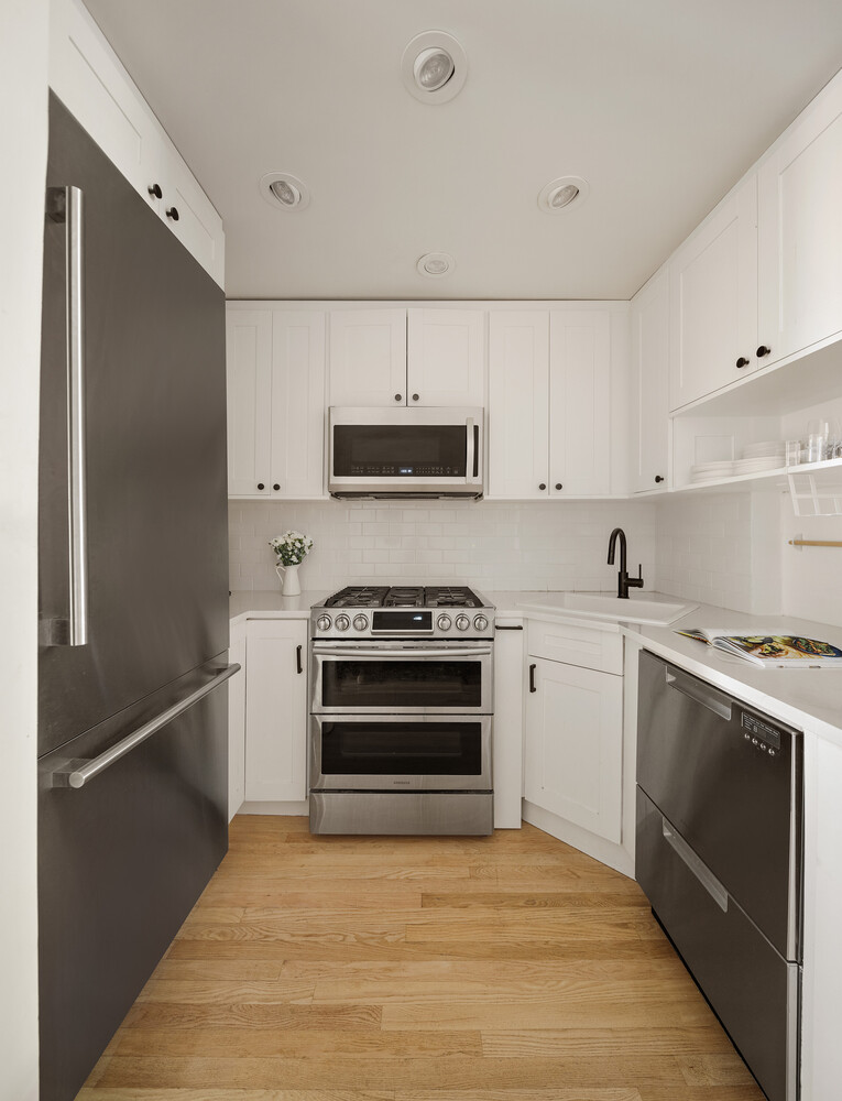 172 West 82nd Street, Unit 2A Manhattan, NY 10024 - Photo 4 of 9 a kitchen with a stove and a refrigerator