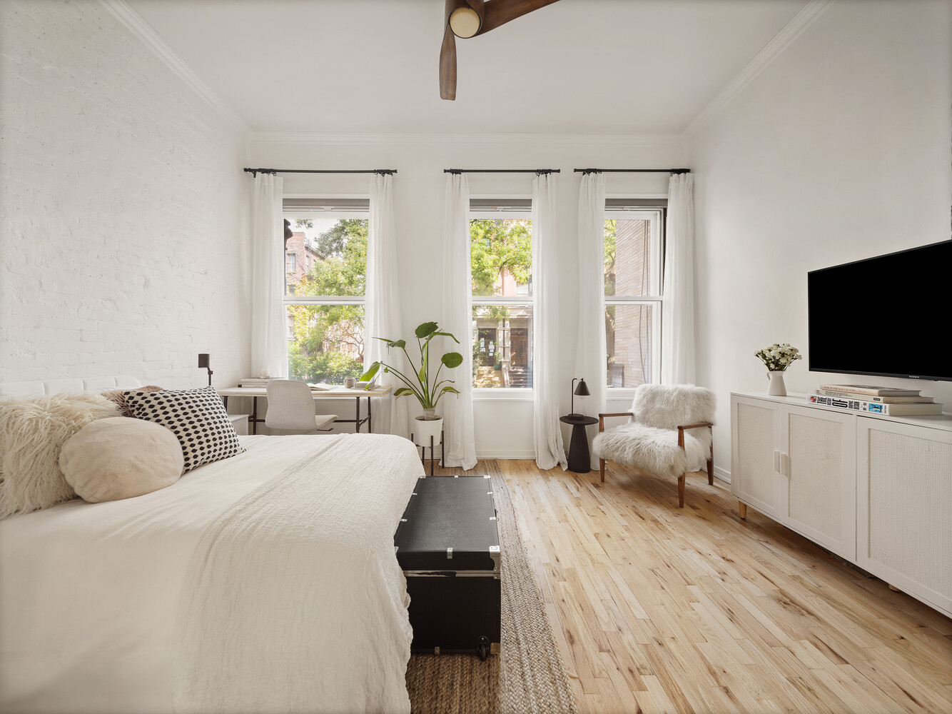 172 West 82nd Street, Unit 2A Manhattan, NY 10024 - Photo 5 of 9 a bedroom with two beds and a flat screen tv