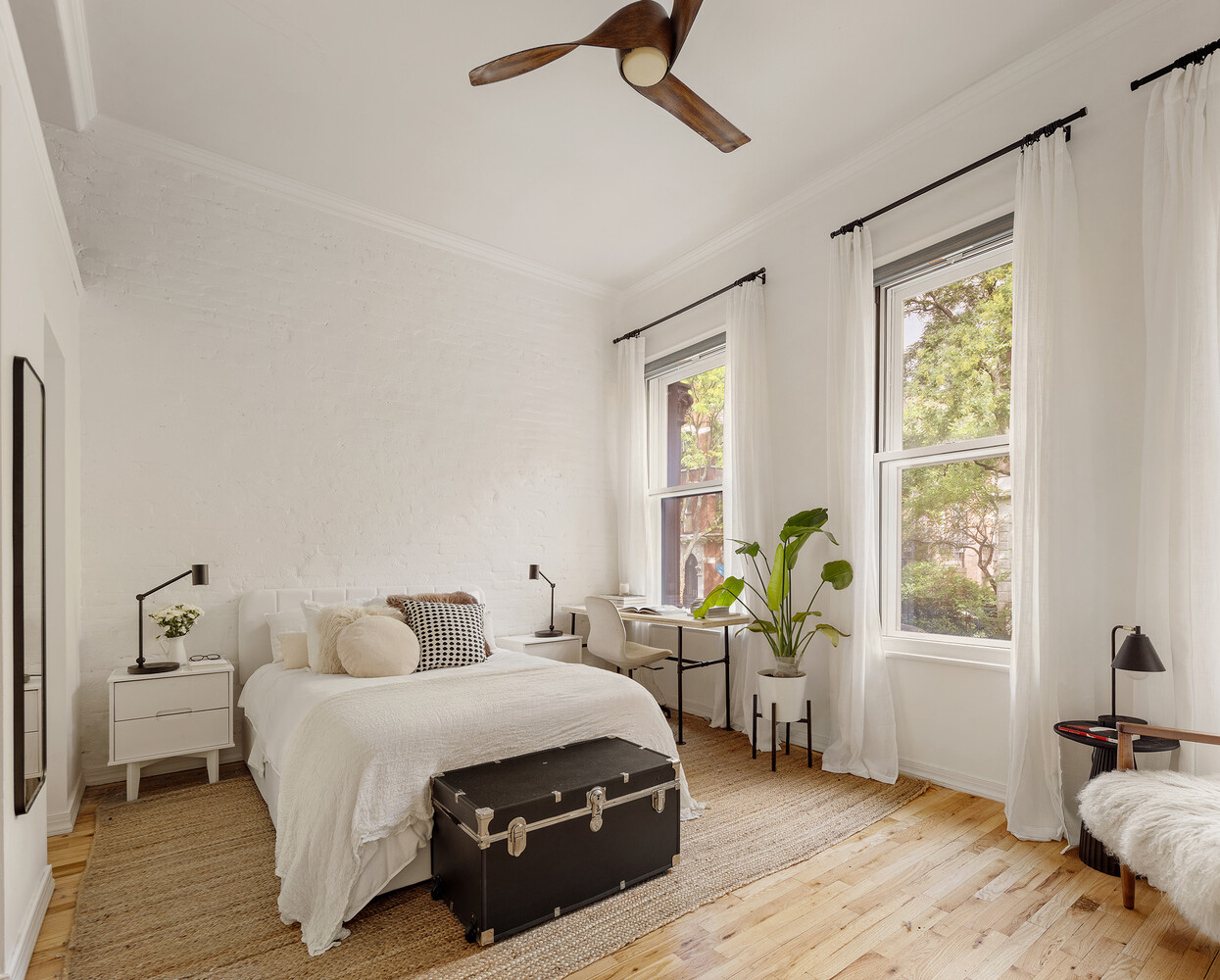 172 West 82nd Street, Unit 2A Manhattan, NY 10024 - Photo 6 of 9 a bedroom with a bed and wooden floor