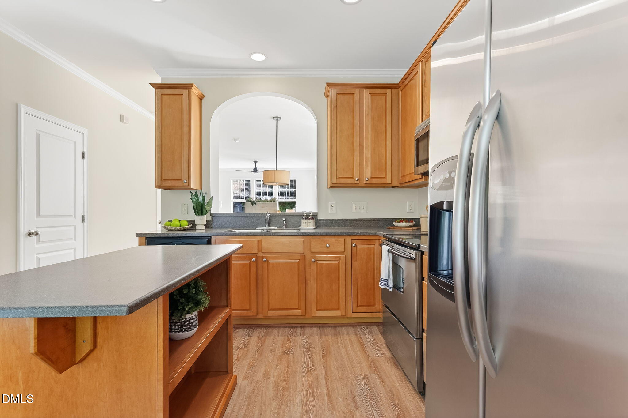 6041 History Trail Raleigh, NC 27612 - Photo 18 of 30 a kitchen with stainless steel appliances granite countertop a refrigerator a sink and a stove