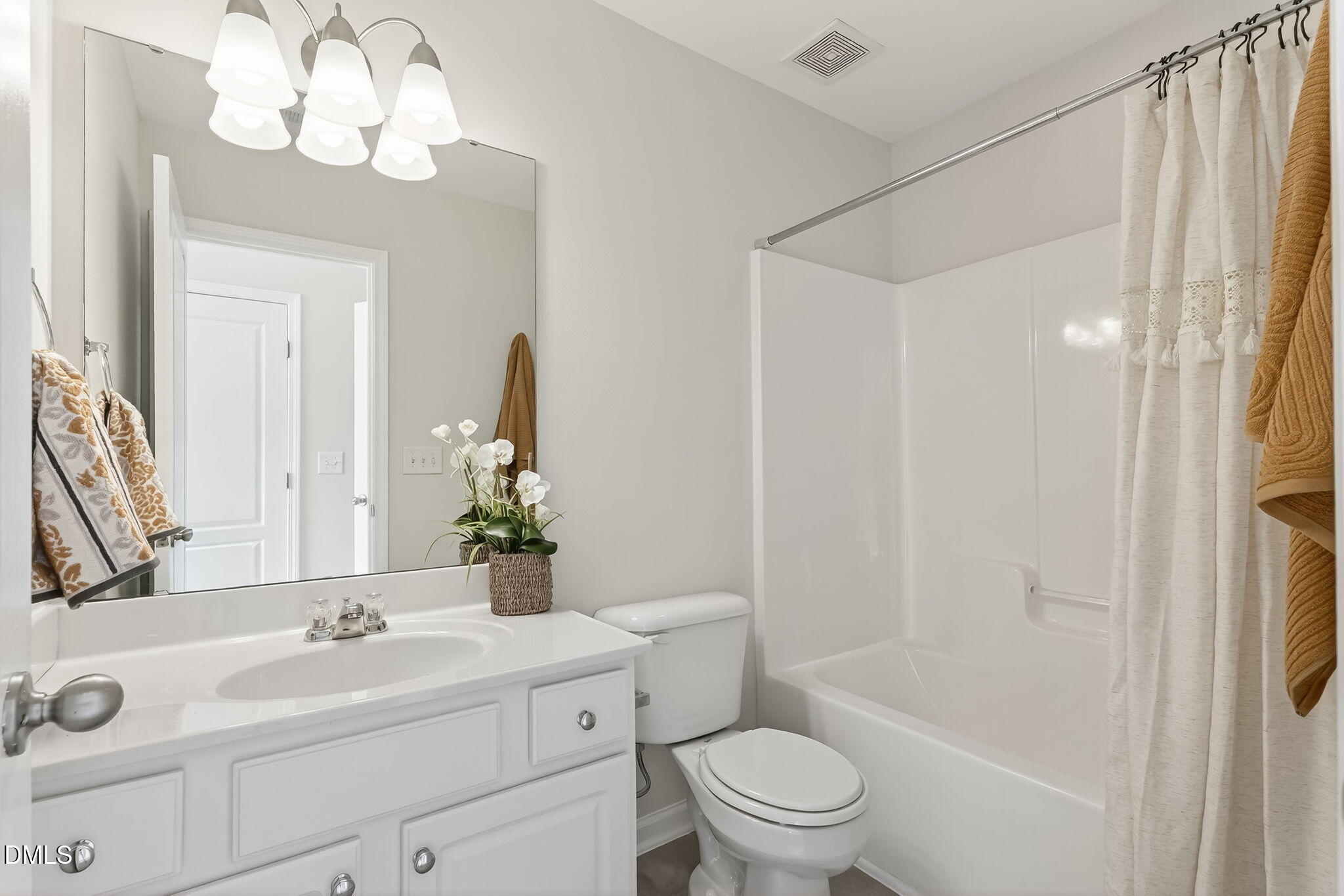 6041 History Trail Raleigh, NC 27612 - Photo 25 of 30 a bathroom with a sink a toilet and shower