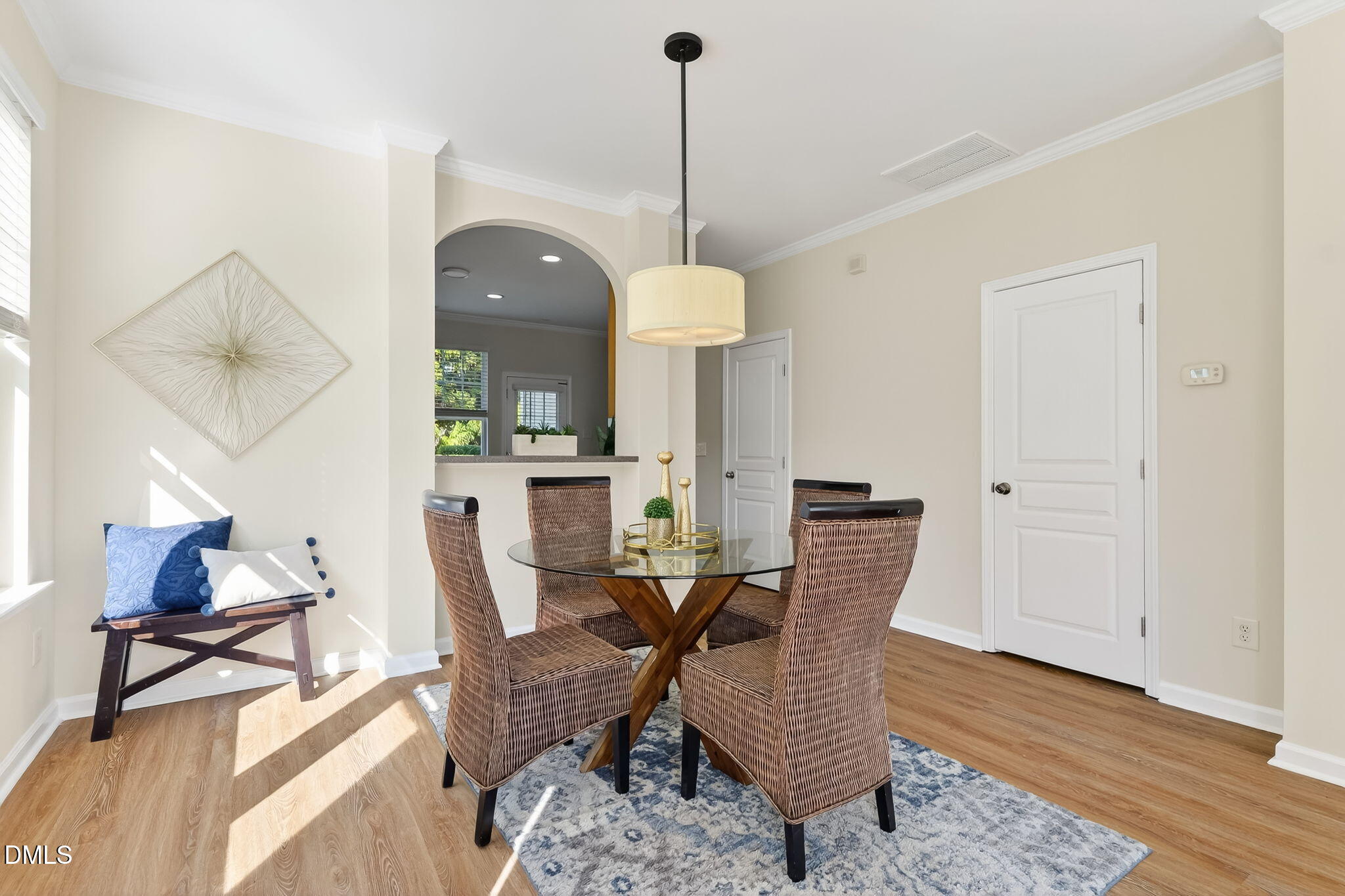 6041 History Trail Raleigh, NC 27612 - Photo 10 of 30 a dining room with furniture a rug and wooden floor