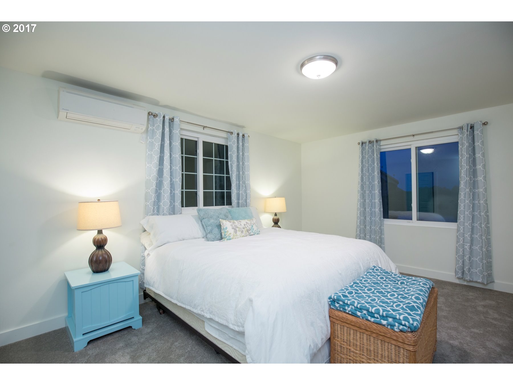 14468 Northwest Larson Road, Unit 3 Portland, OR 97231 - Photo 12 of 20 a bedroom with a bed and a window