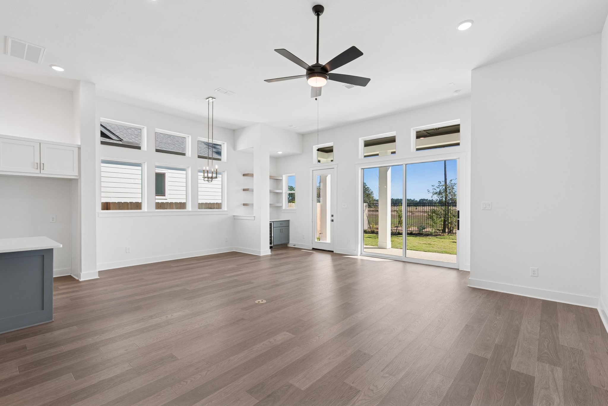 16138 Rita Road Conroe, TX 77302 - Photo 31 of 50 a view of an empty room with a window and wooden floor