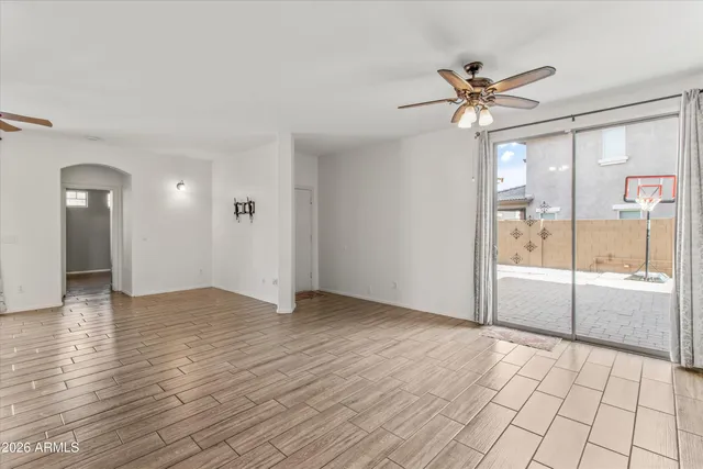 a large kitchen with kitchen island granite countertop a large counter top and wooden cabinets