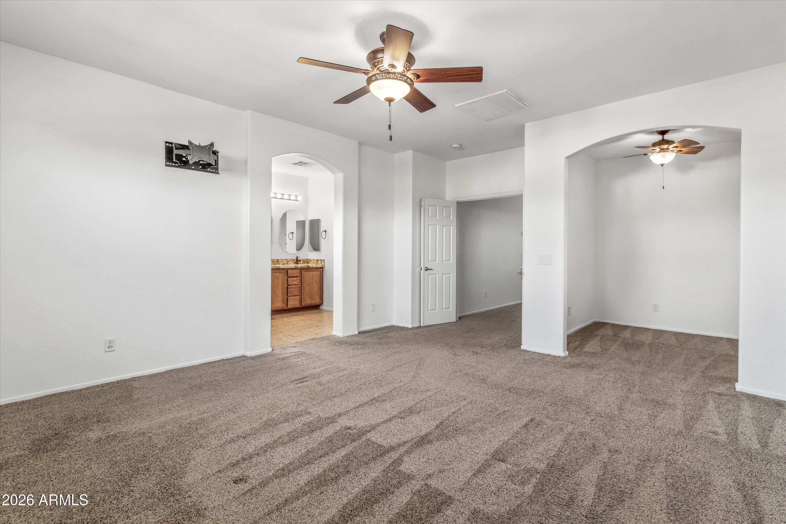 16510 West Tether Trail Surprise, AZ 85387 - Photo 21 of 47 wooden floor in an empty room