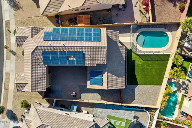 an aerial view of residential houses with outdoor space