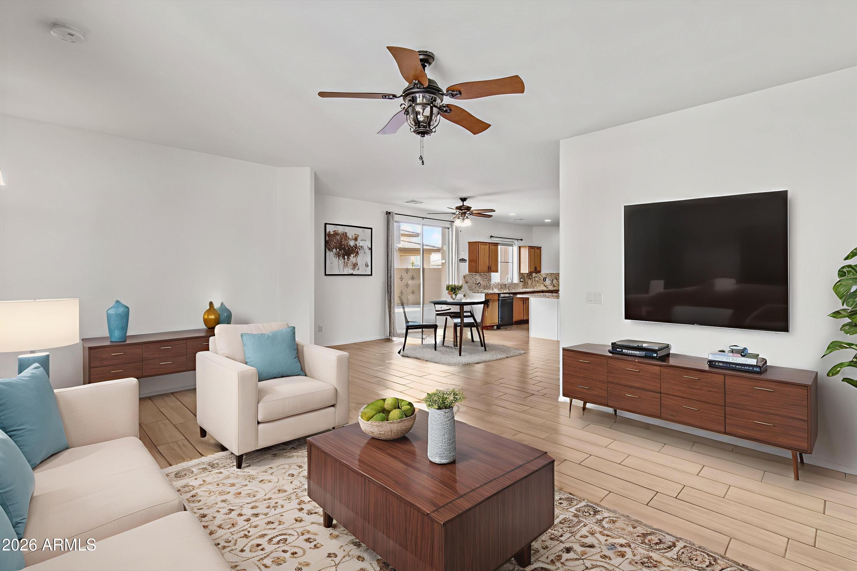 16510 West Tether Trail Surprise, AZ 85387 - Photo 5 of 47 a living room with furniture and a flat screen tv