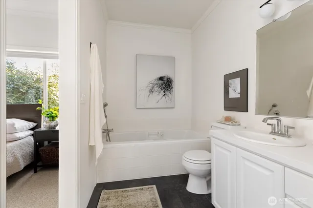 a bathroom with a toilet a sink and a bathtub