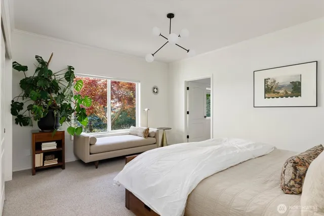 a bedroom with bed and a couch