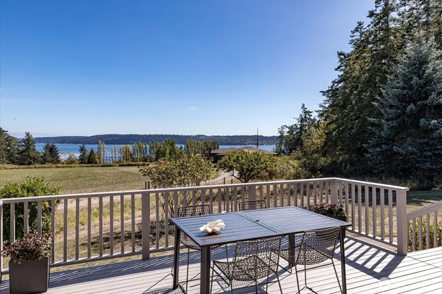 a view of a chairs and table on the deck