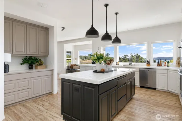 a kitchen with a sink and cabinets