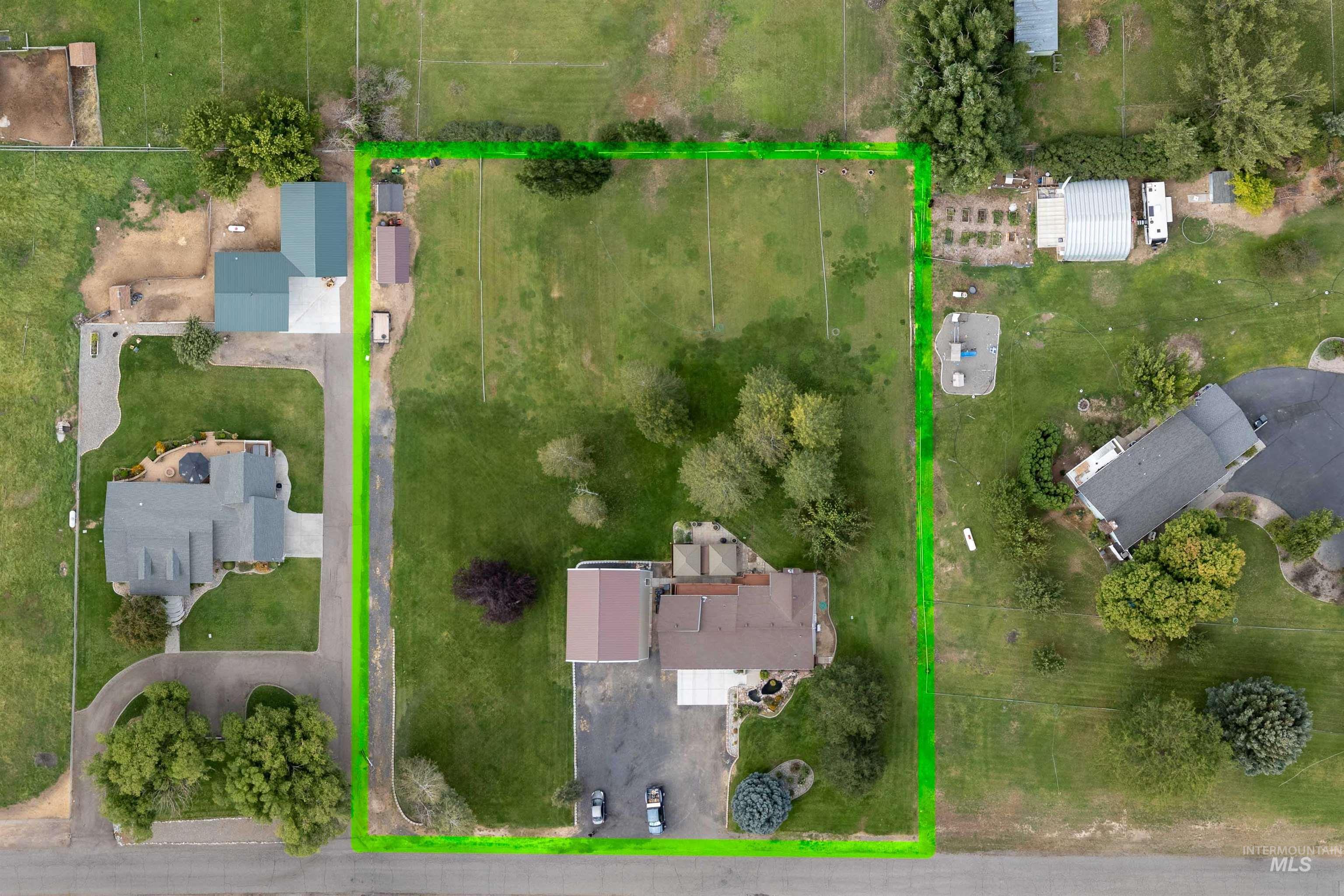 216 Ranch View Road West Jerome, ID 83338 - Photo 38 of 42 Expansive lot with a single-family residence, detached accessory dwelling unit, and mature trees