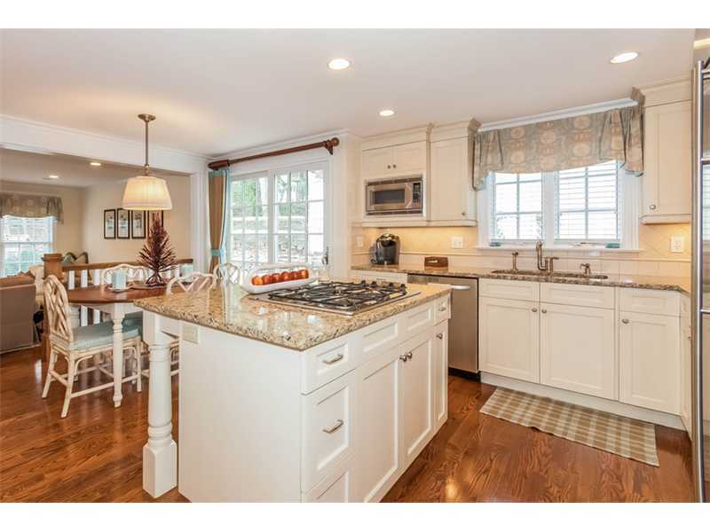 27 Devon Road Darien, CT 06820 - Photo 8 of 21 a kitchen with a sink stove and cabinets