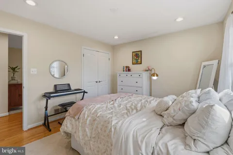 a living room with furniture and a book shelf