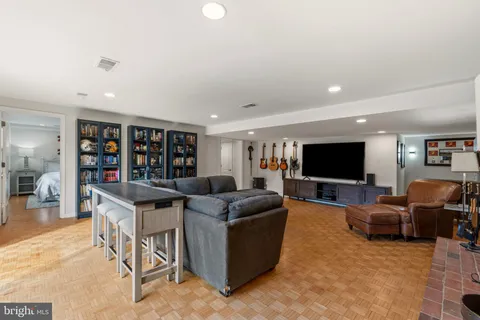 a front view of a house with yard and green space