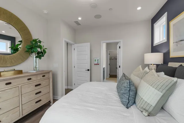 a bedroom with a bed and a dresser