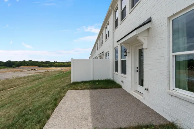 a view of a patio with a yard