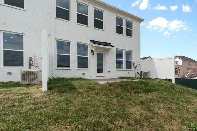 a view of a house with backyard