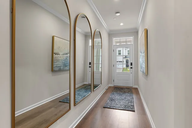 a view of room with window and hallway