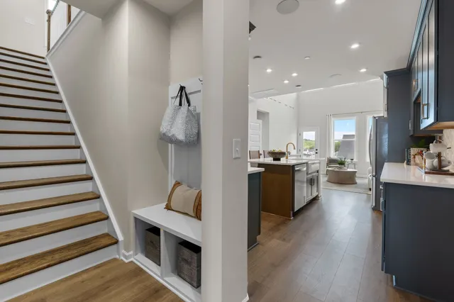 a view of kitchen with sink and wooden floor