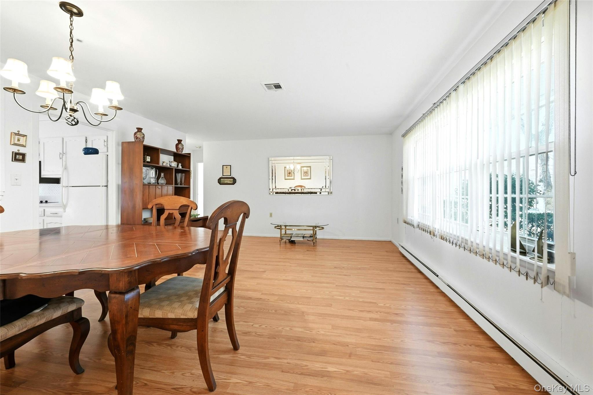 128 D Exmore Court Ridge, NY 11961 - Photo 12 of 45 Large Open Living Room & Dining Room