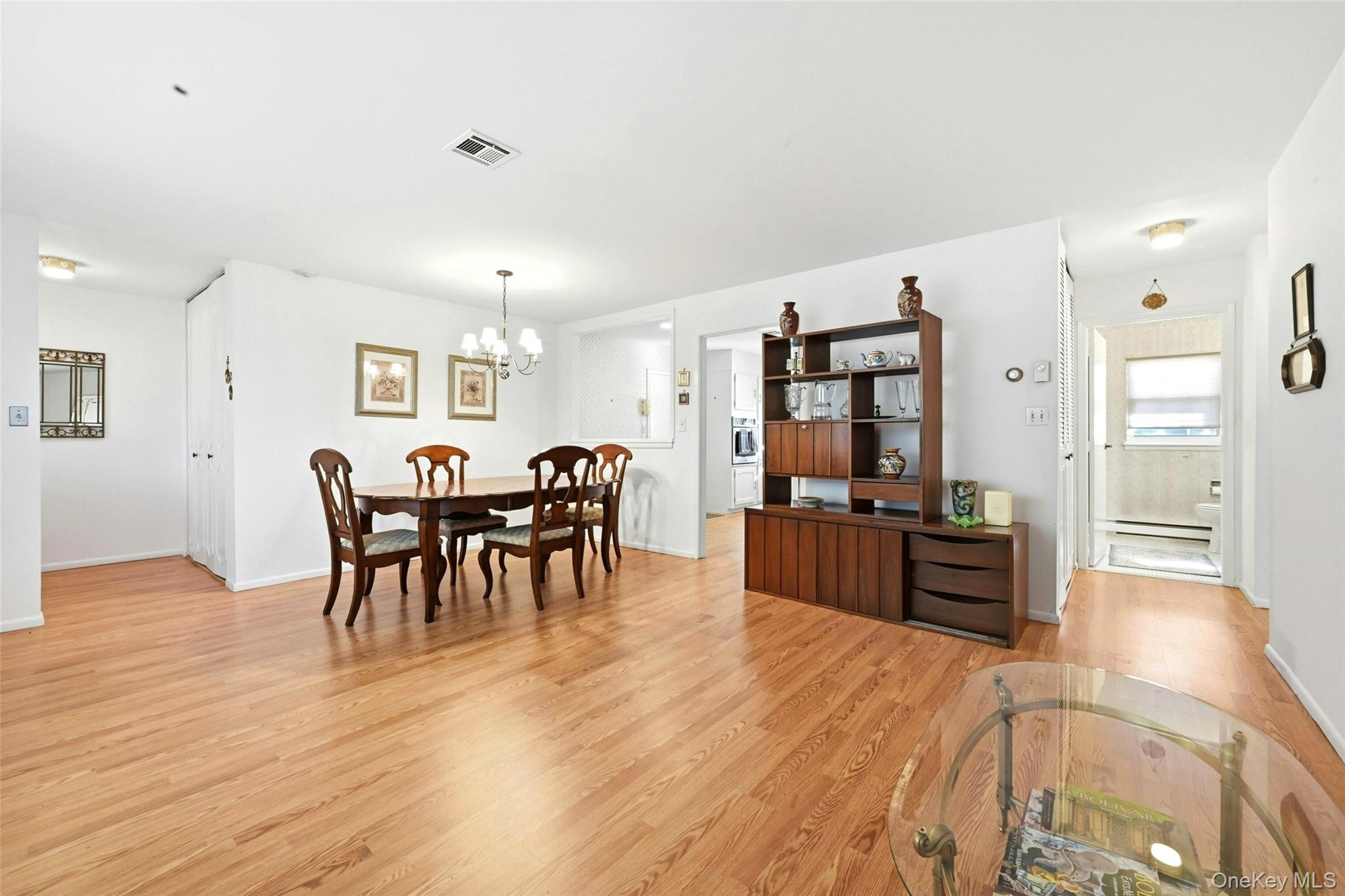 128 D Exmore Court Ridge, NY 11961 - Photo 13 of 45 Large Open Living Room & Dining Room.