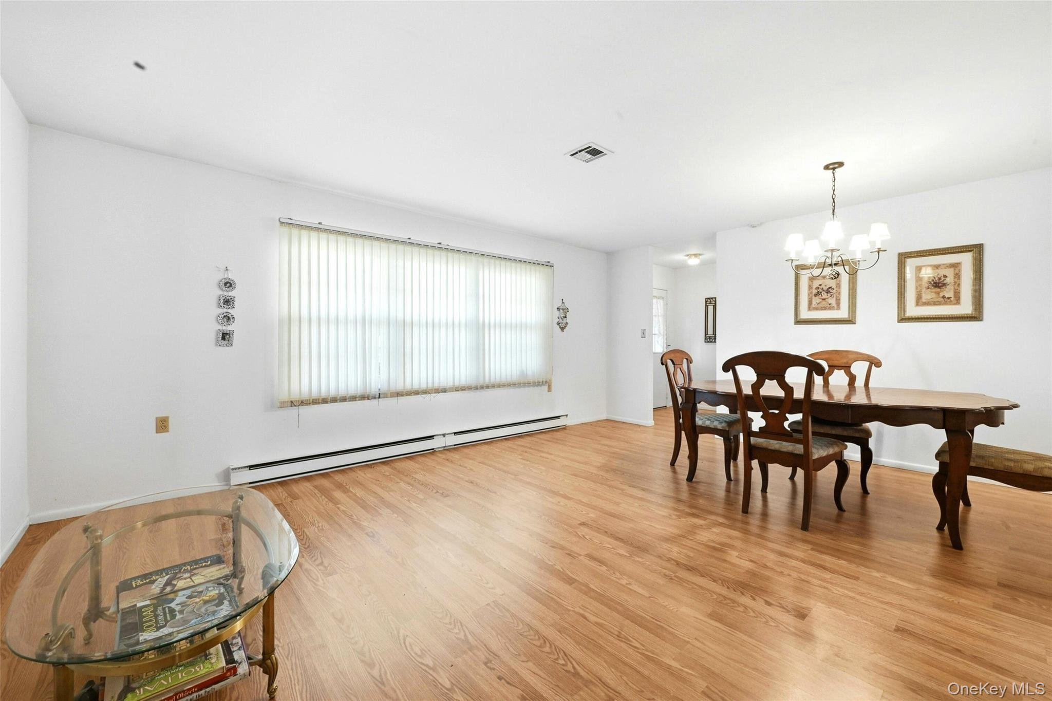 128 D Exmore Court Ridge, NY 11961 - Photo 14 of 45 Large Open Living Room & Dining Room.