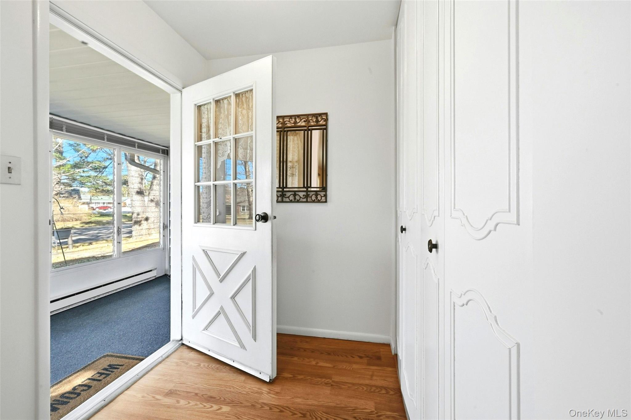 128 D Exmore Court Ridge, NY 11961 - Photo 22 of 45 Door From The Condo Into The Three Season Room.