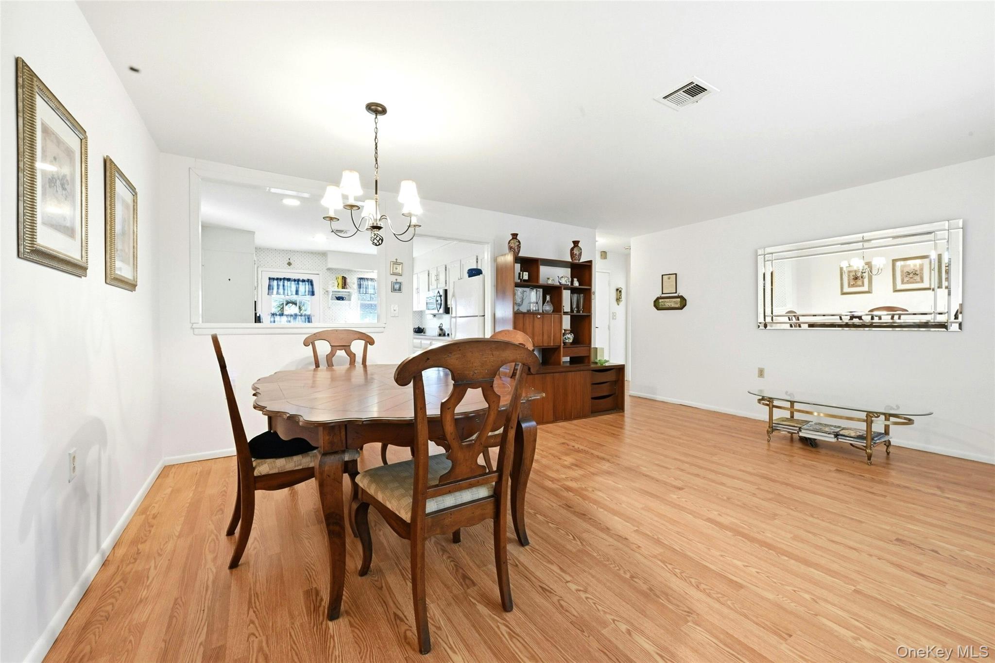 128 D Exmore Court Ridge, NY 11961 - Photo 10 of 45 Large Open Living Room & Dining Room