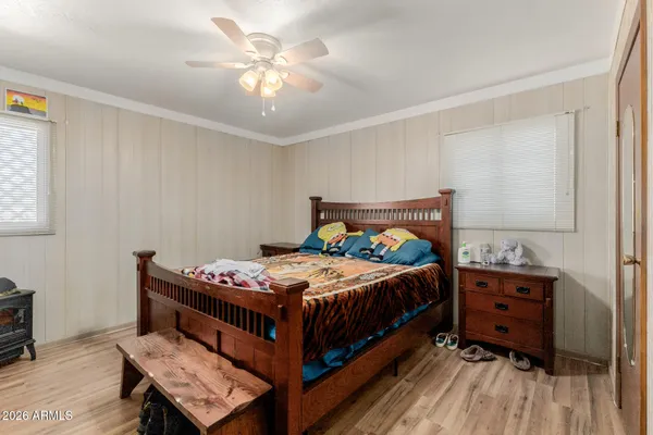 a bedroom with a bed and a chandelier