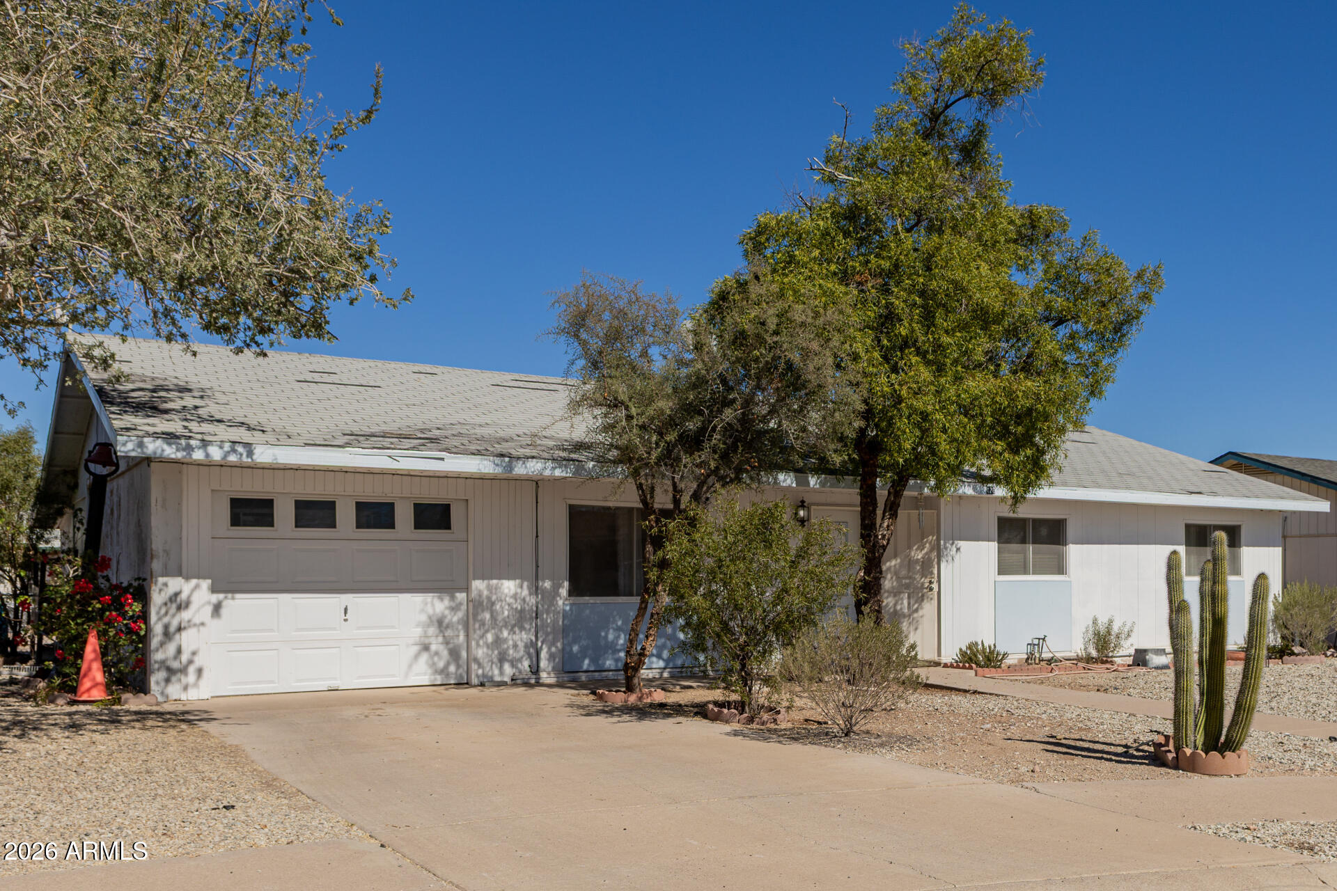 420 West 6th Street Ajo, AZ 85321 - Photo 2 of 35 a front view of a house with a yard and garage