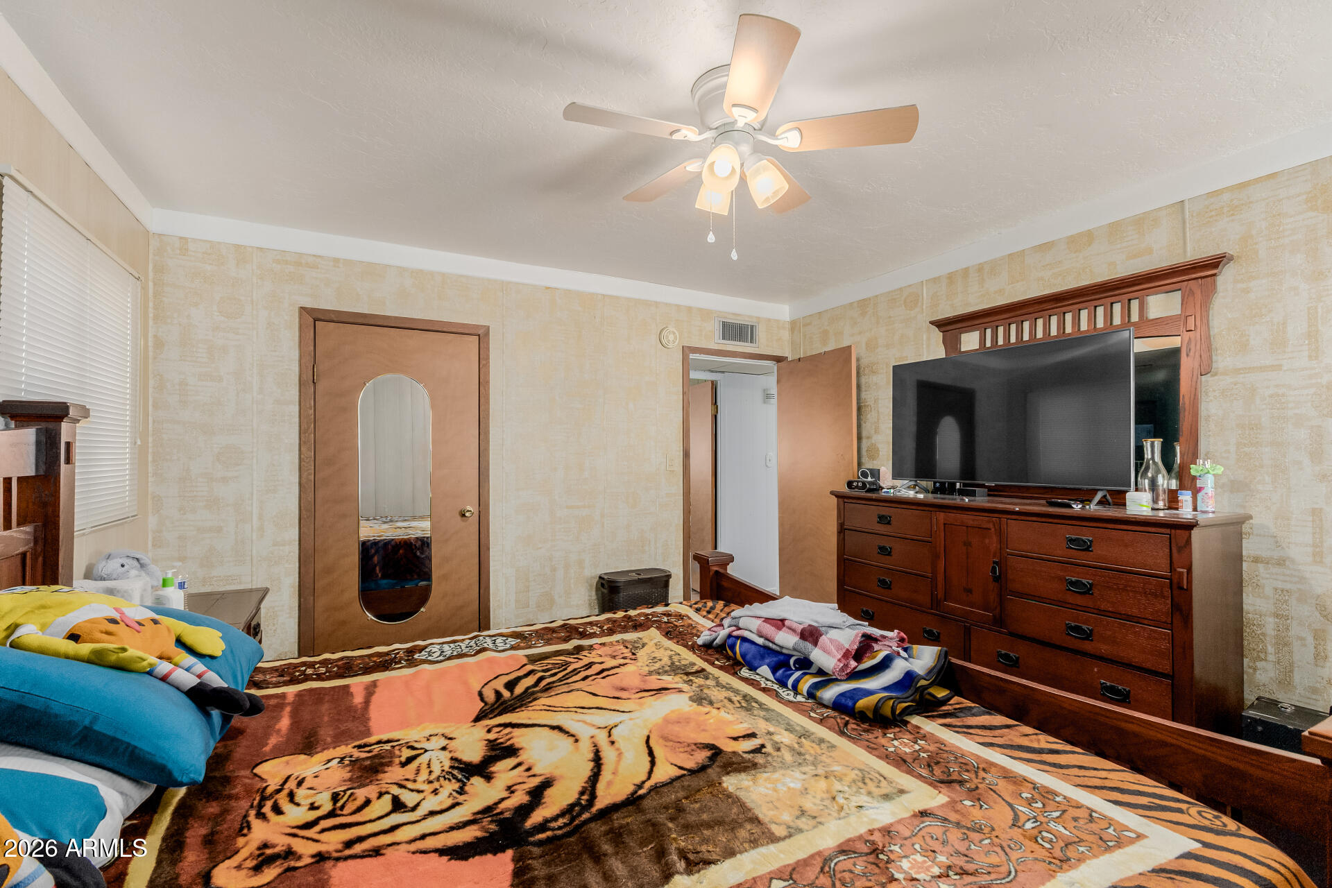 420 West 6th Street Ajo, AZ 85321 - Photo 21 of 35 a bedroom with a bed and a flat screen tv