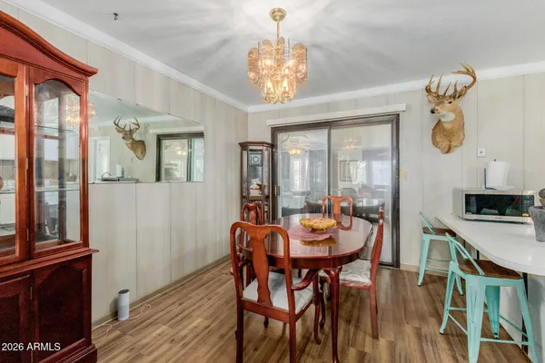 a view of a dining room with furniture window and wooden floor