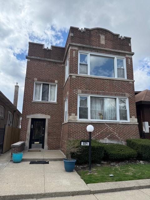 8204 South Elizabeth Street, Unit 2 Chicago, IL 60620 - Photo 1 of 11 a front view of a house