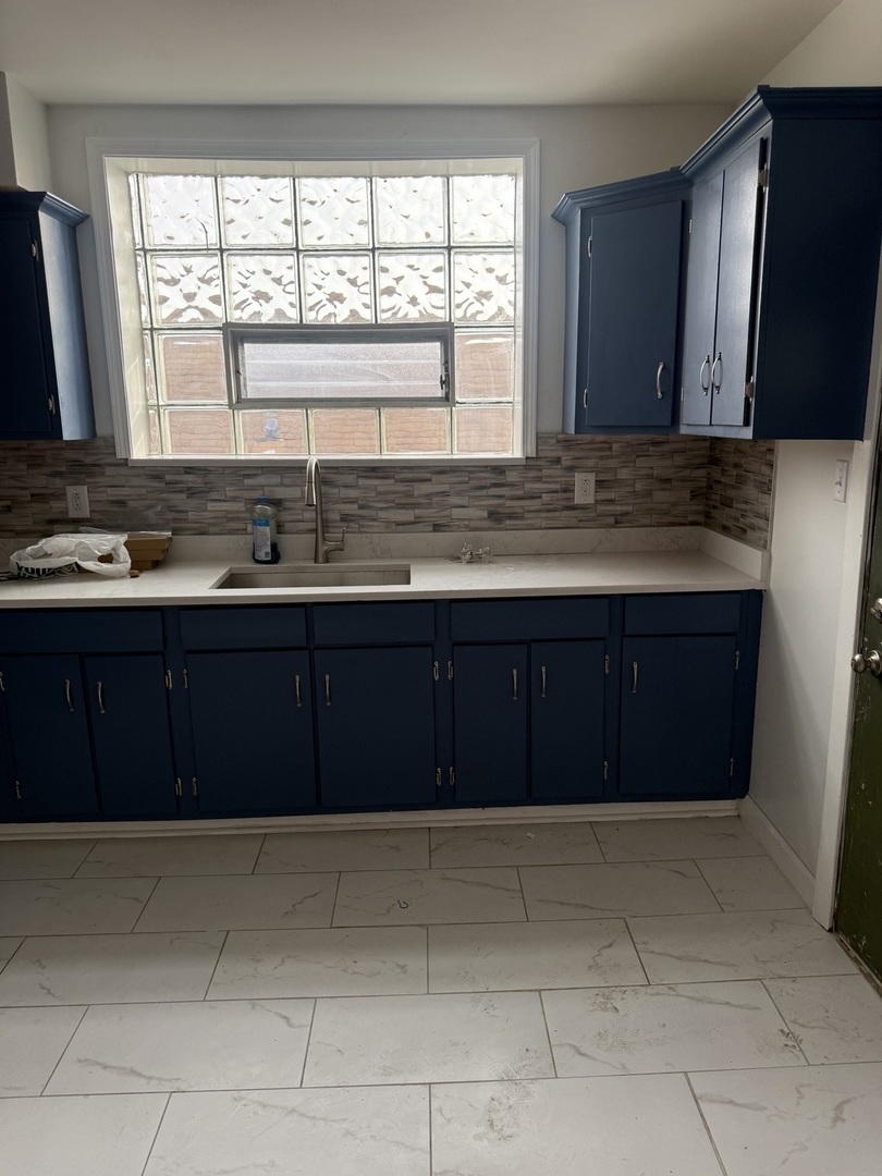 8204 South Elizabeth Street, Unit 2 Chicago, IL 60620 - Photo 11 of 11 a kitchen with a cabinets and window