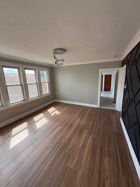 8204 South Elizabeth Street, Unit 2 Chicago, IL 60620 - Photo 5 of 11 wooden floor in an empty room with a window