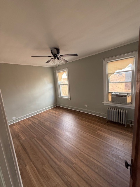 8204 South Elizabeth Street, Unit 2 Chicago, IL 60620 - Photo 7 of 11 wooden floor in an empty room with a window