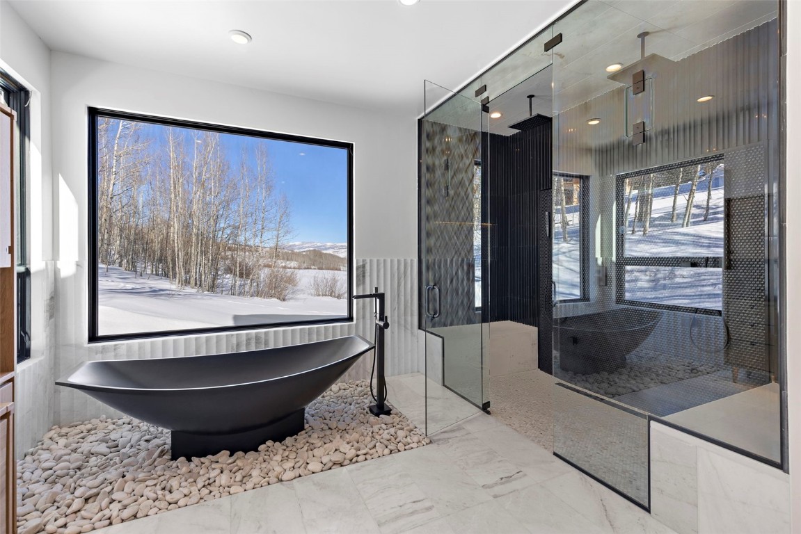 149 Game Trail Road Silverthorne, CO 80498 - Photo 21 of 49 a living room with furniture and a large window