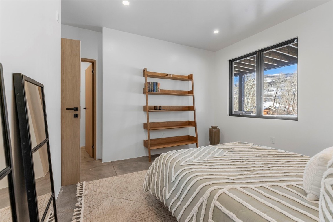 149 Game Trail Road Silverthorne, CO 80498 - Photo 31 of 49 a bedroom with a bed and a window