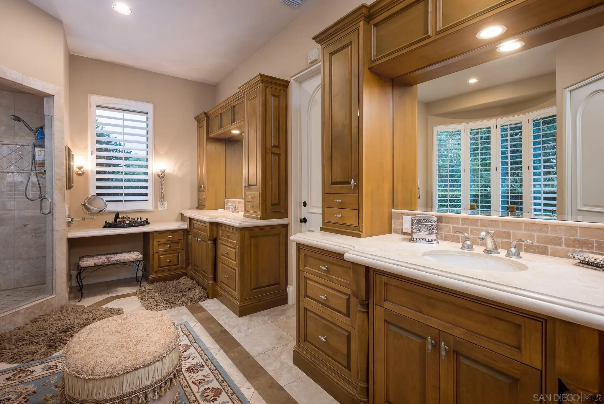 14725 Rancho Santa Fe Farms Road Rancho Santa Fe, CA 92067 - Photo 15 of 50 a spacious bathroom with a sink a toilet a mirror and shower