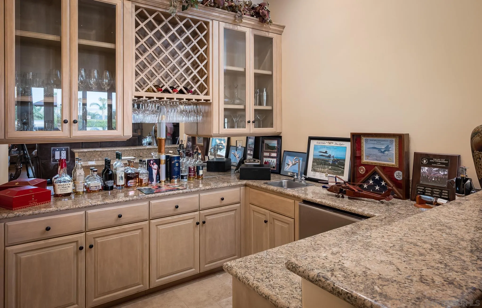 14725 Rancho Santa Fe Farms Road Rancho Santa Fe, CA 92067 - Photo 17 of 50 a kitchen with a sink and cabinets